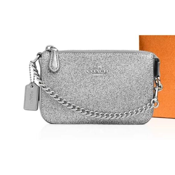 Coach Handbags - Coach Silver Glitter Wristlet Clutch